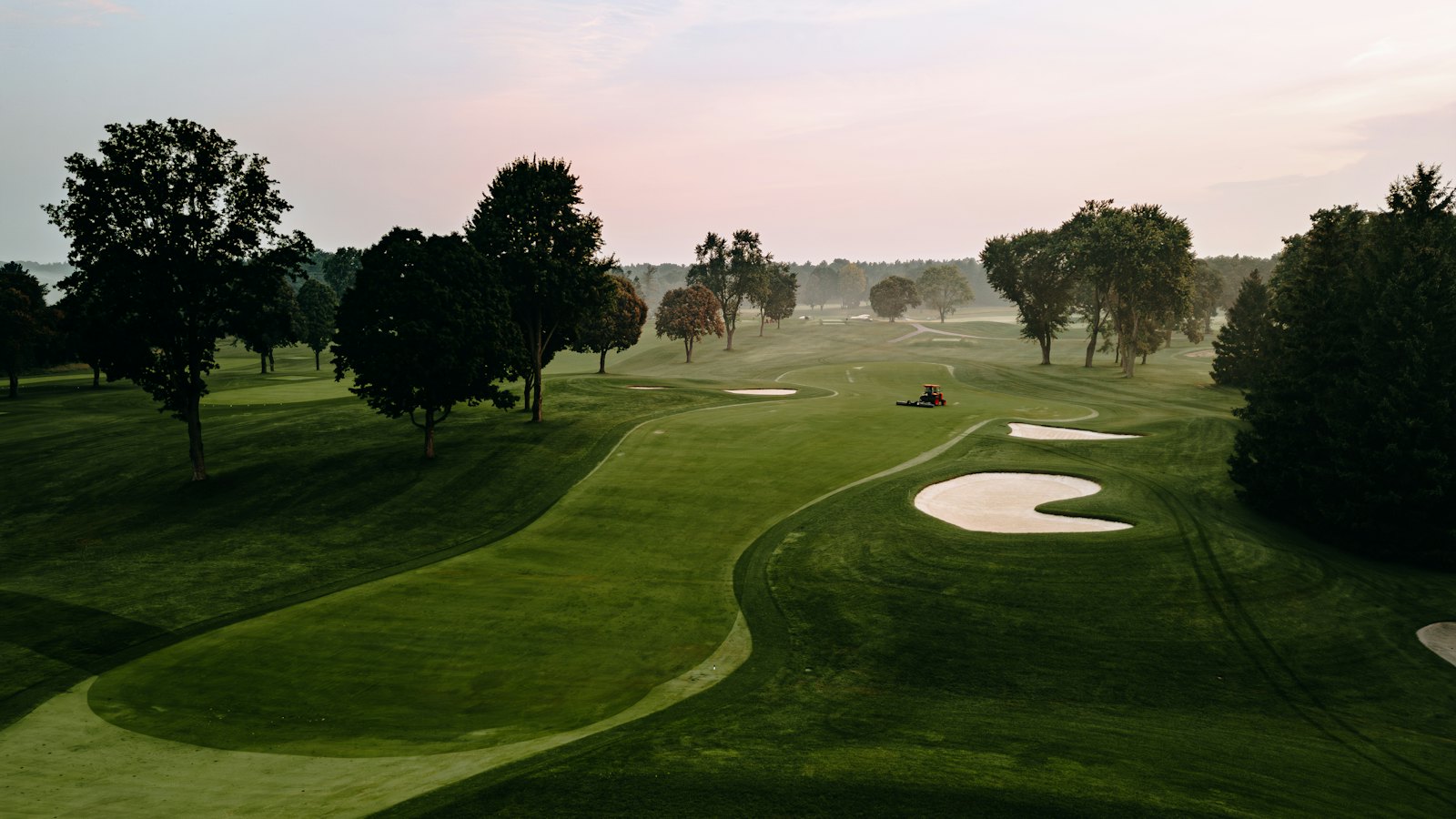 A tree-lined fairway on a golf course