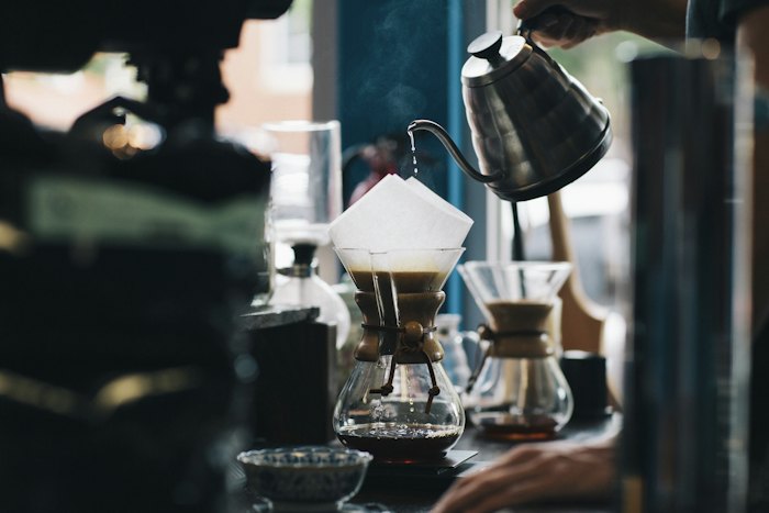Pour-over coffee being brewed with a gooseneck kettle