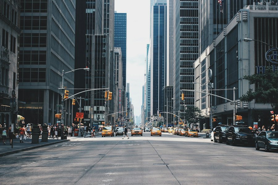 Downtown street between tall buildings with taxis