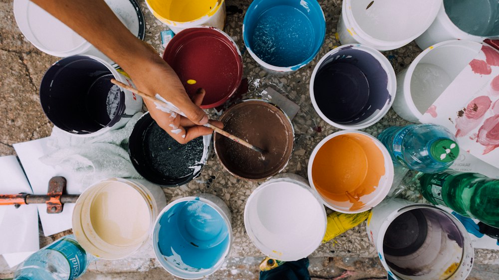 An artist's studio with canvases and paint