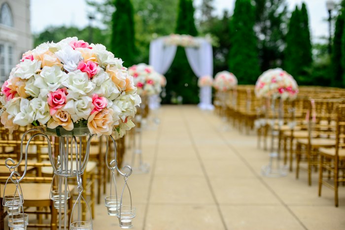 Floral wedding arch set up on a lawn