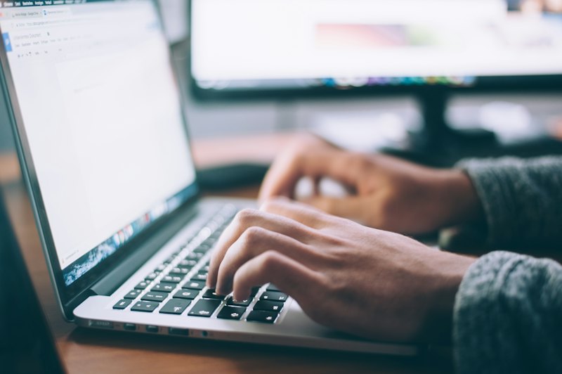 Person reviewing figures on a laptop