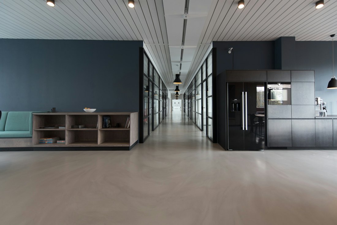 Modern office interior with a long corridor and wood panelling