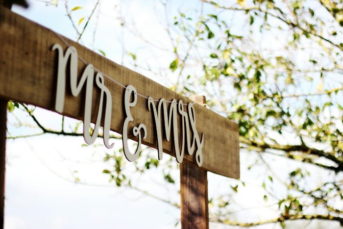 Mr and Mrs sign decorated with fresh flowers