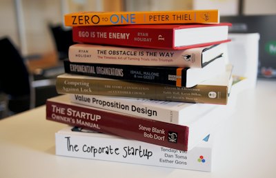 Open book lying on a wooden table
