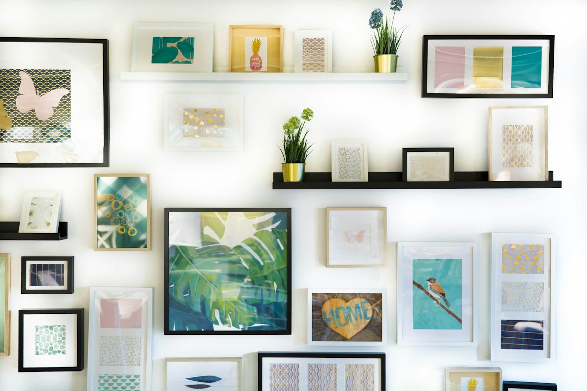 Framed paintings in a bright room