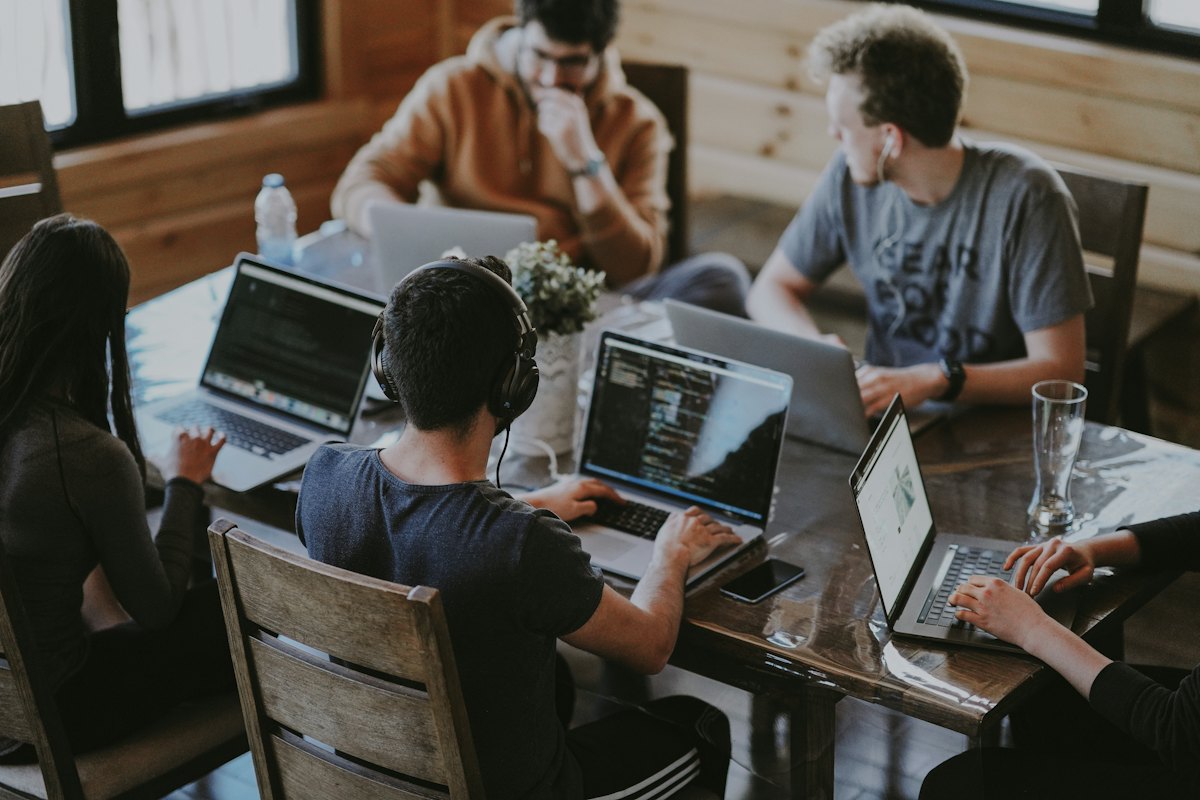 A small team working together around laptops