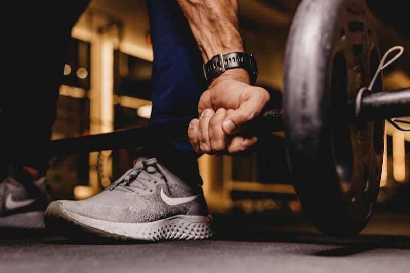 Athlete gripping a barbell before a lift