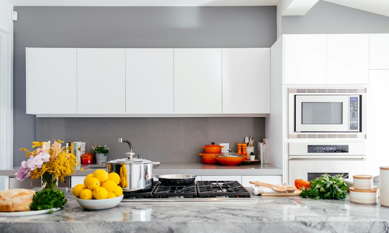 Bright, tidy kitchen with white cabinets