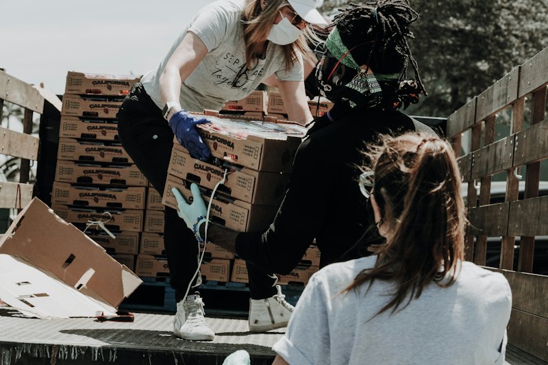 Volunteers sorting supplies into boxes