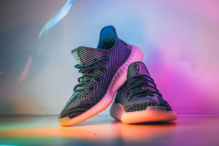 Knit sneaker lit with neon green and purple light
