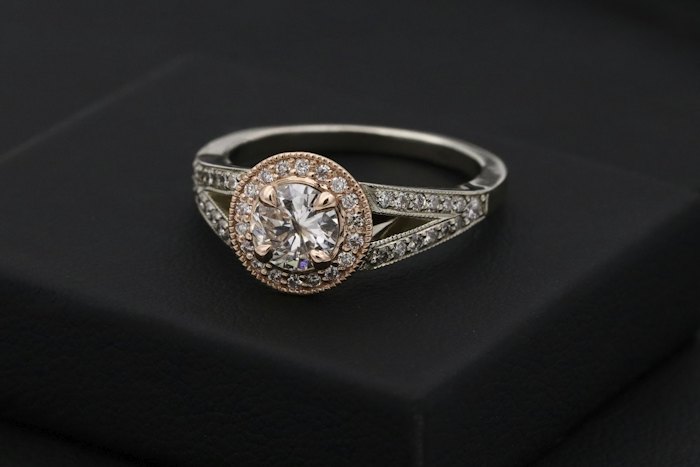Halo diamond ring on a dark background