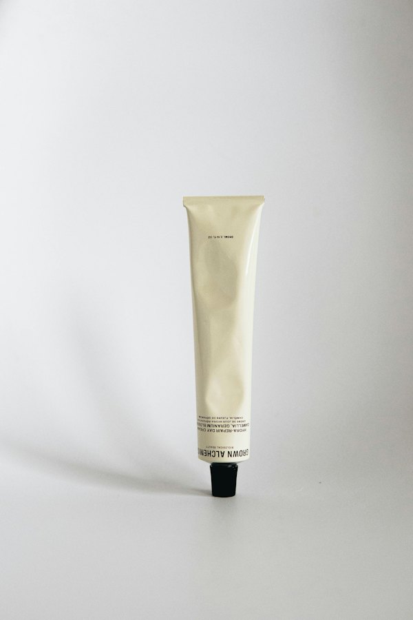 Plain cream tube on a white background