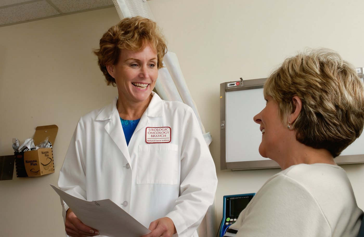 A nurse checking an elderly patient